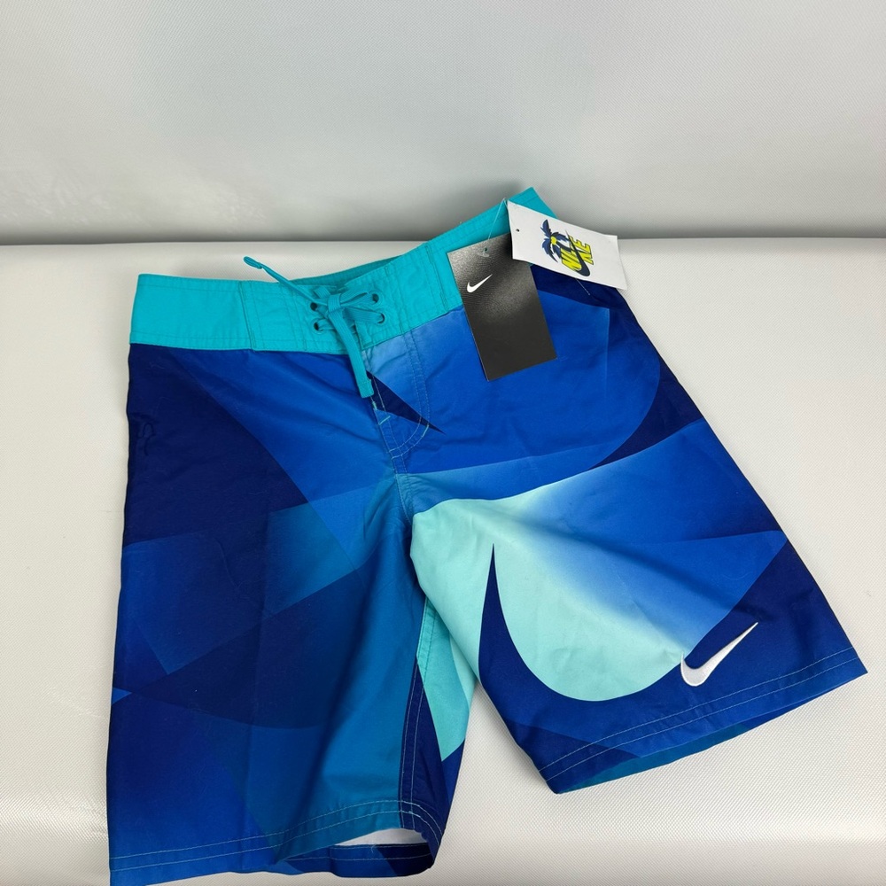 Nike BOYS swim trunks. ‎ NWT size XL and small.
